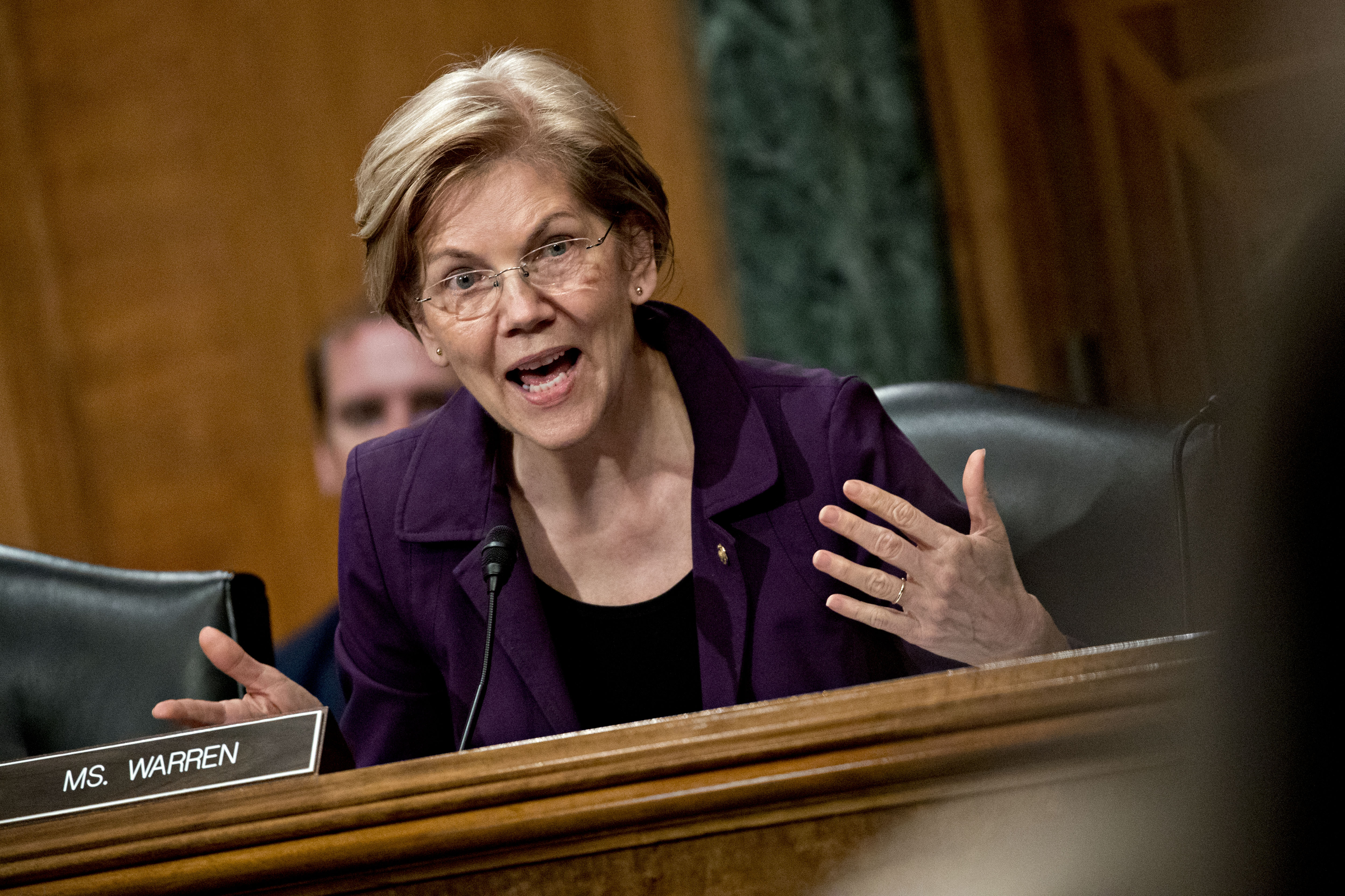 Warren knocks bank regulators as too permissive on mergers - Vimarsana News
